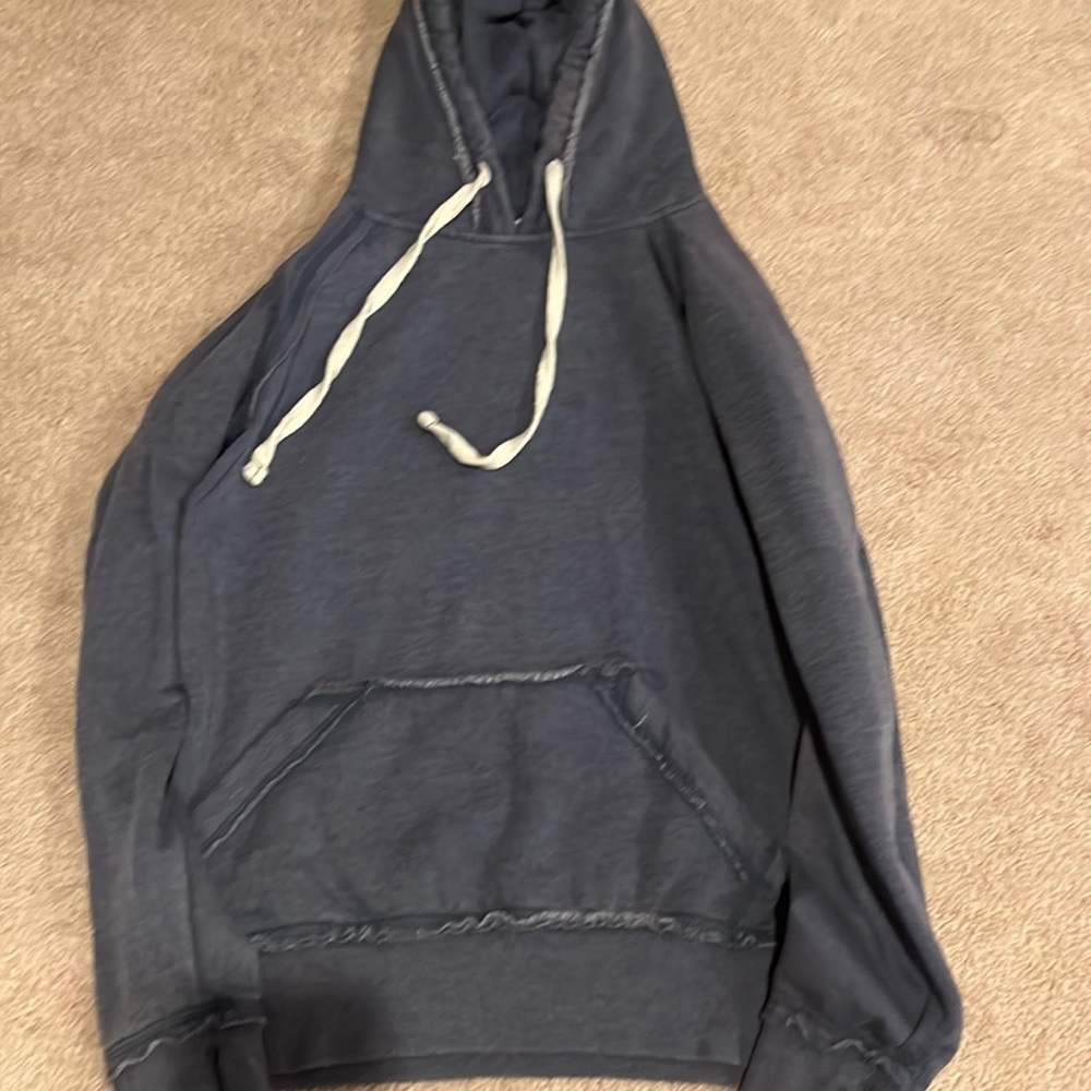 A navy blue sweatshirt, that is very comfy,and it looks very pretty and comfy